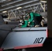U.S. Sailors work on an F/A-18E Super Hornet aboard the aircraft carrier USS John C. Stennis (CVN 74)