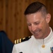 Naval Air Facility Atsugi Operations Officer Cmdr. Eric Lindgren prepares to pass through sideboys during his retirement ceremony.