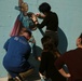 SPMAGTF Marines and Sailors Paint School Mural