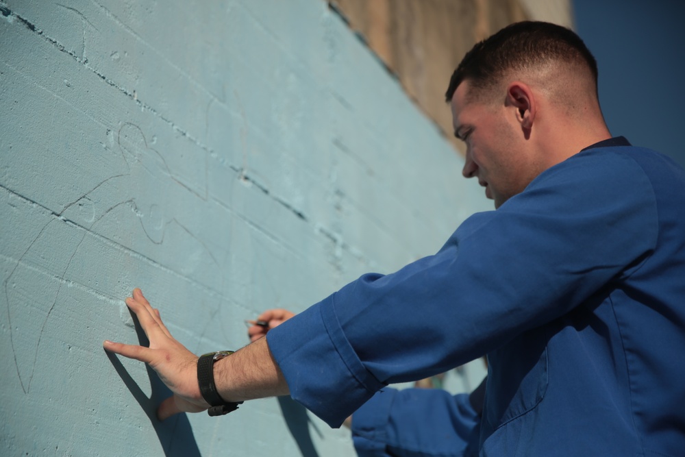 SPMAGTF Marines and Sailors Paint School Mural