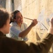 SPMAGTF Marines and Sailors Paint School Mural