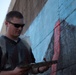 SPMAGTF Marines and Sailors Paint School Mural