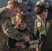 Airman shows brothers how to use EOD robot during pilot for a day program