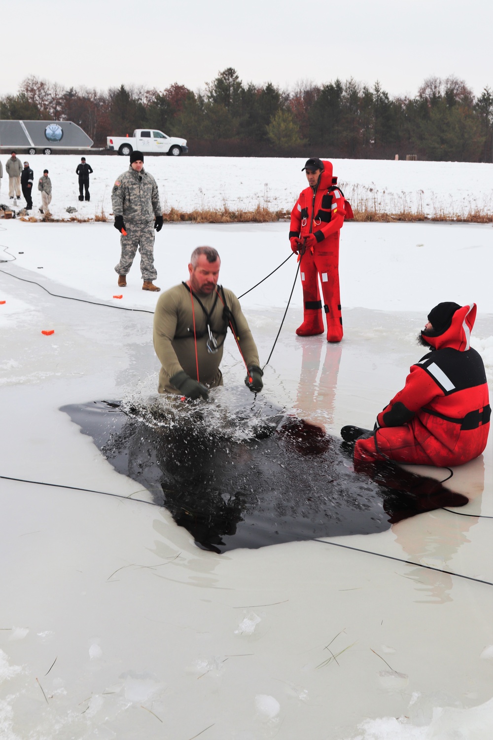 Students participate in cold-water immersion training for CWOC Class 19-01 at Fort McCoy