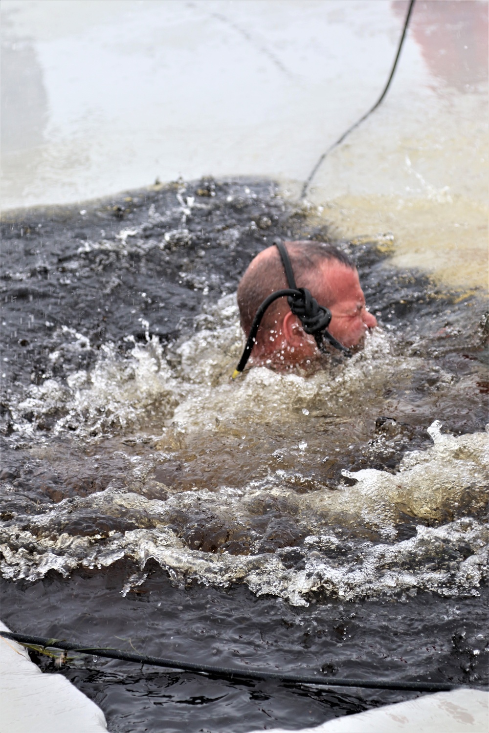 Students participate in cold-water immersion training for CWOC Class 19-01 at Fort McCoy