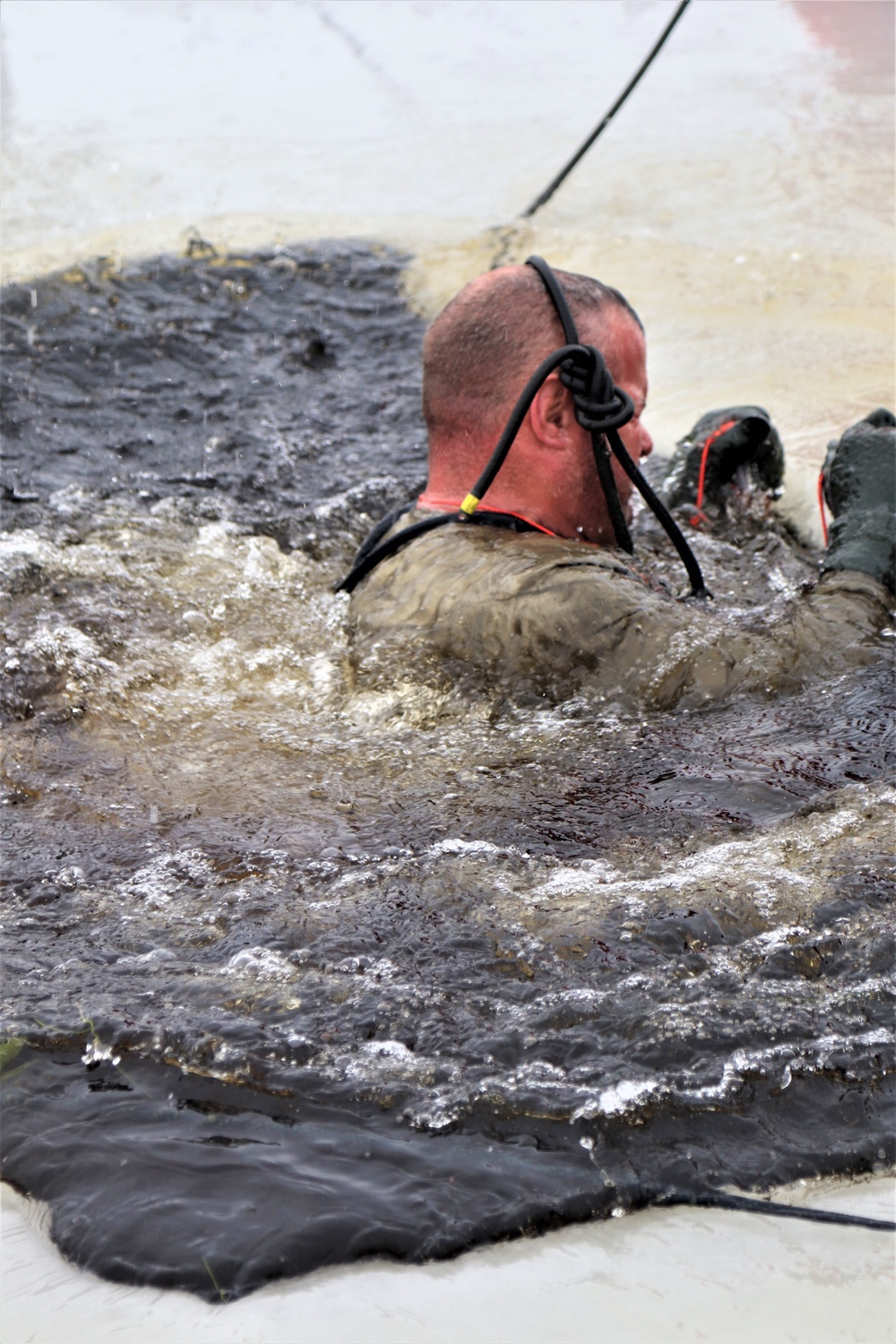 Students participate in cold-water immersion training for CWOC Class 19-01 at Fort McCoy