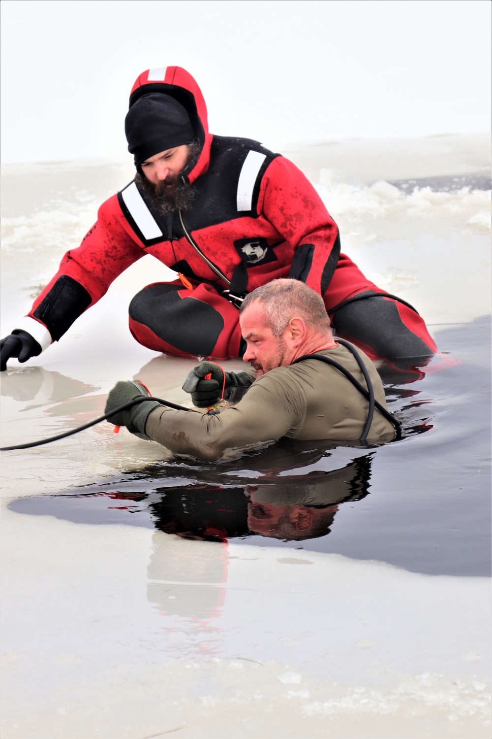 Students participate in cold-water immersion training for CWOC Class 19-01 at Fort McCoy