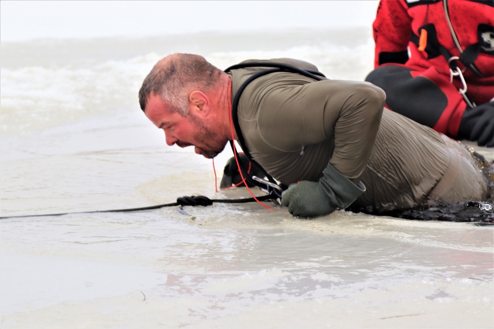 Students participate in cold-water immersion training for CWOC Class 19-01 at Fort McCoy