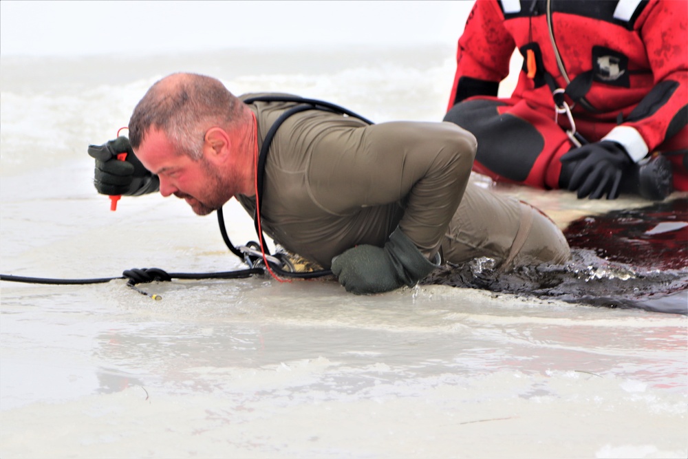 Students participate in cold-water immersion training for CWOC Class 19-01 at Fort McCoy