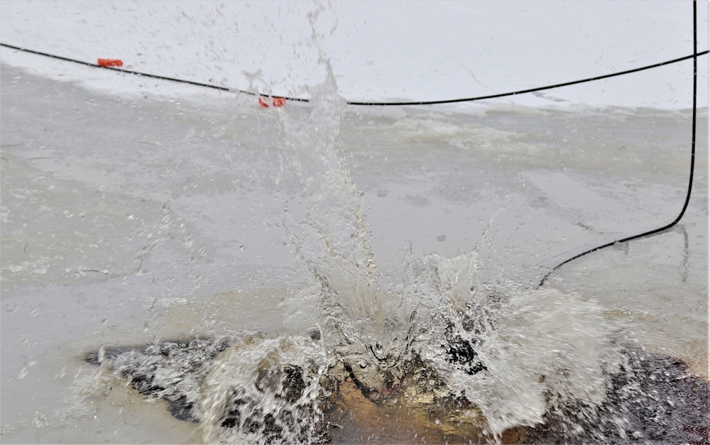 Students participate in cold-water immersion training for CWOC Class 19-01 at Fort McCoy