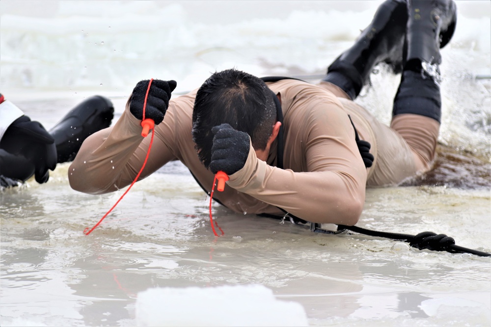 Students participate in cold-water immersion training for CWOC Class 19-01 at Fort McCoy