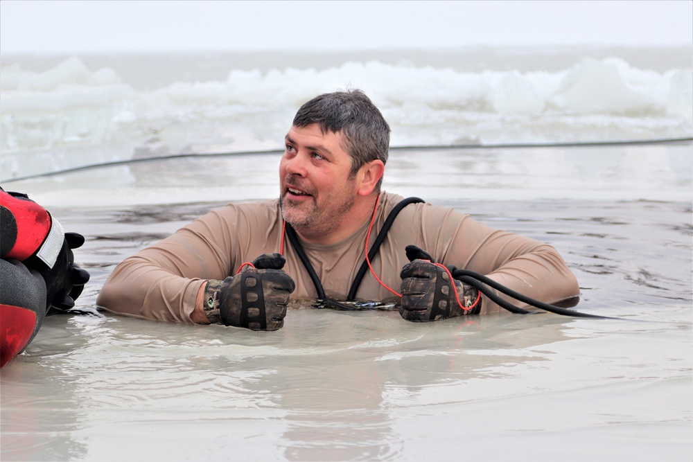 Students participate in cold-water immersion training for CWOC Class 19-01 at Fort McCoy