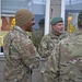 Staff Sgt. Brendan Richmond, left, and Tech. Sgt. Gregory Myers share a laugh with Danish soldiers