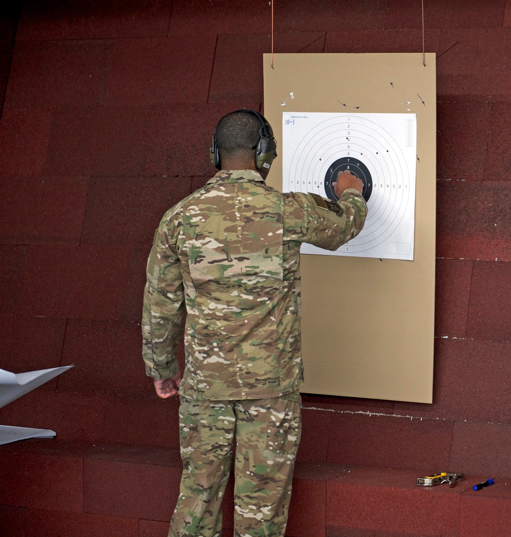 Tech. Sgt. Gregory Myers checks his targets for scoring