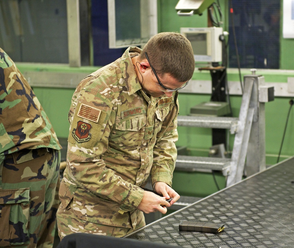 Staff Sgt. Brendan Richmond loads a magazine