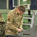 Staff Sgt. Brendan Richmond loads a magazine