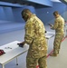 Tech. Sgt. Gregory Myers, left, loads his weapon alongside the rest of the Air Force Reserve Command Shooting Team