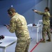 Staff Sgt. Brendan Richmond, left, prepares to fire