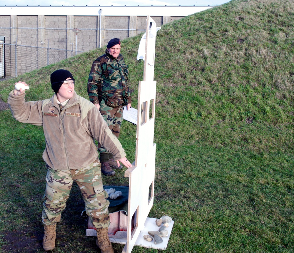 Staff Sgt. Sabrina Yeghiazarian throws a dummy grenade