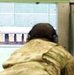 Tech. Sgt. Gregory Myers looks down range at his target