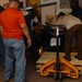 DLA staff members carefully move Naval Museum's larger artifacts