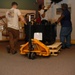 DLA staff members carefully move Naval Museum's larger artifacts