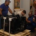DLA staff members carefully move Naval Museum's larger artifacts