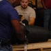 DLA staff members carefully move Naval Museum's larger artifacts
