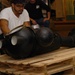 DLA staff members carefully move Naval Museum's larger artifacts