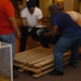DLA staff members carefully move Naval Museum's larger artifacts