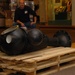 DLA staff members carefully move Naval Museum's larger artifacts