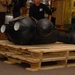 DLA staff members carefully move Naval Museum's larger artifacts