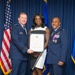 Lt. Gen. Scobee presents certificate to Mrs. Olivia Terry