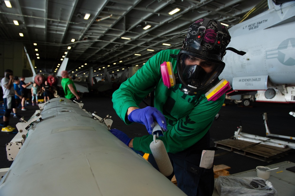 U.S. Sailor paints in the hanagr bay