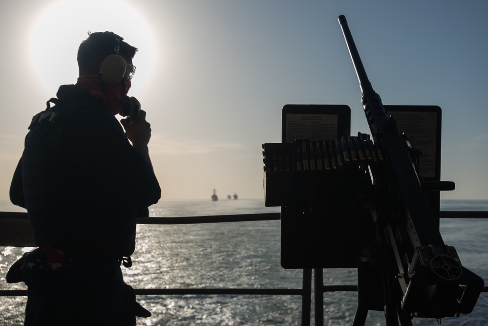 U.S. Sailor stands watch aboard the aircraft carrier USS John C. Stennis (CVN 74)
