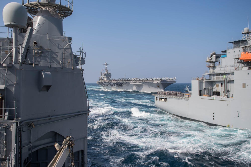 USS Mobile Bay and USS John C. Stennis conduct a replenishment-at-sea with USNS Charles Drew