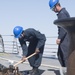 U.S. Navy Sailors drop the anchor aboard the guided-missile destroyer USS Spruance (DDG 111) off the coast of Duqm, Oman