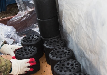 Field Artillery Soldiers Help Local Residents Stay Warm Through Winter