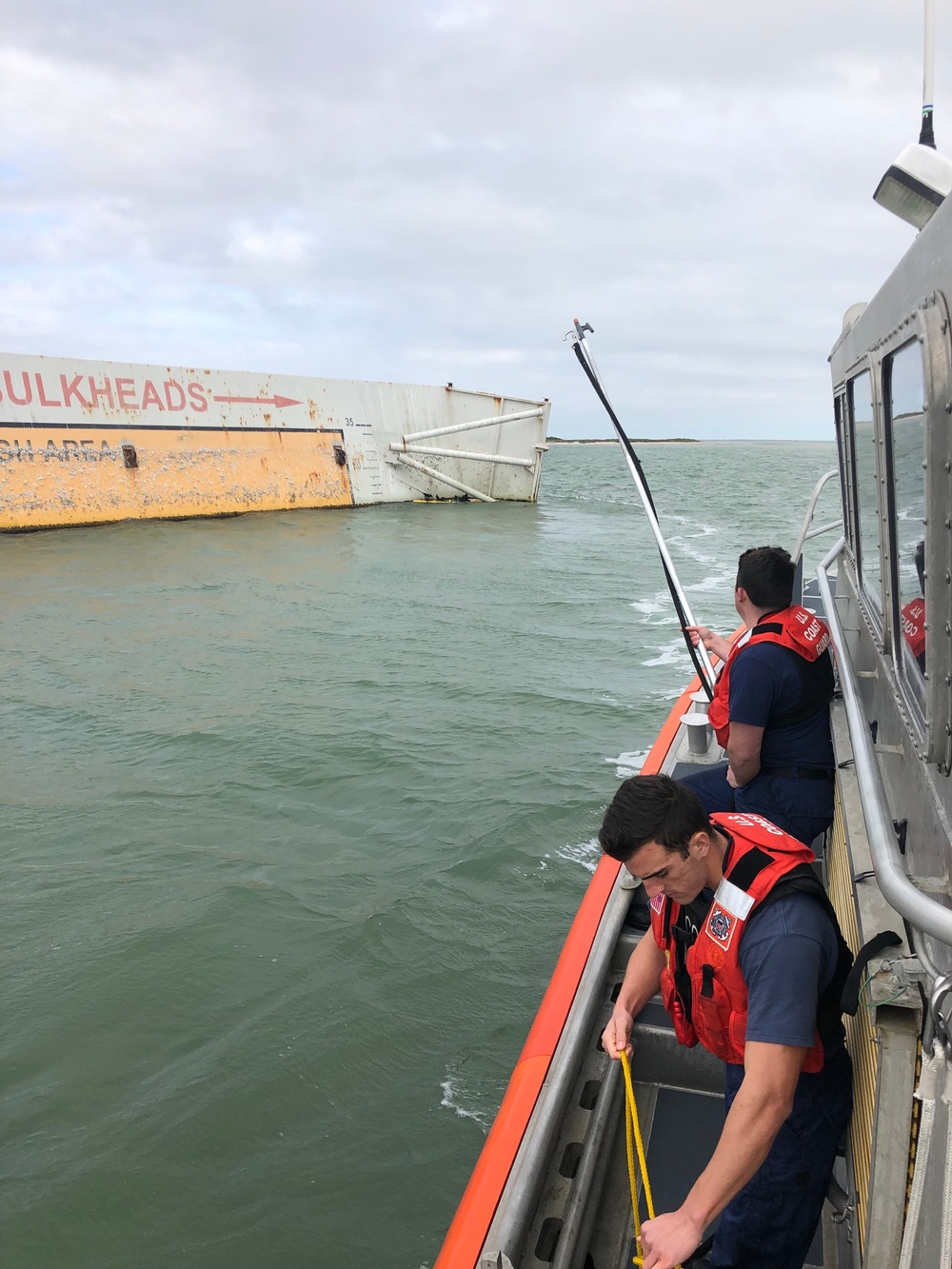 Coast Guard rescues 2 fishermen from capsized kayak