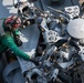 U.S. Sailor conducts maintenance on an MH-60R Sea Hawk  aboard the aircraft carrier USS John C. Stennis (CVN 74)