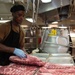 U.S. Sailor prepares ribs aboard the aircraft carrier USS John C. Stennis (CVN 74)