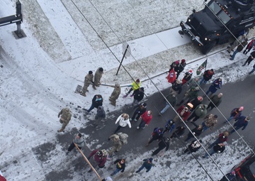 NY Troops Volunteer Support During Glens Falls' Christmas Eve Road March