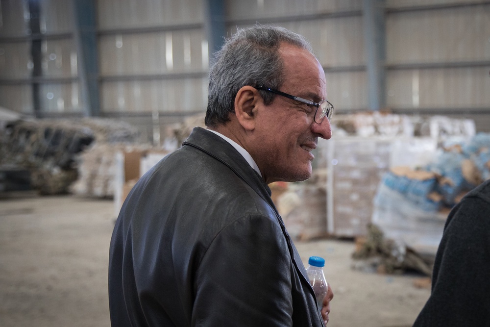 Coalition Forces members distribute pallets of medical supplies to SDF, local doctors