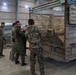 Coalition Forces members distribute pallets of medical supplies to SDF, local doctors