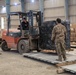 Coalition Forces members distribute pallets of medical supplies to SDF, local doctors