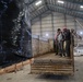 Coalition Forces members distribute pallets of medical supplies to SDF, local doctors