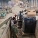 Coalition Forces members distribute pallets of medical supplies to SDF, local doctors