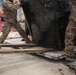 Coalition Forces members distribute pallets of medical supplies to SDF, local doctors