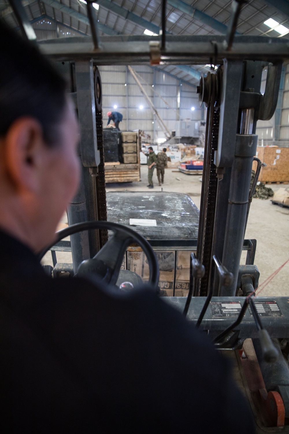 Coalition Forces members distribute pallets of medical supplies to SDF, local doctors