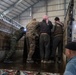 Coalition Forces members distribute pallets of medical supplies to SDF, local doctors